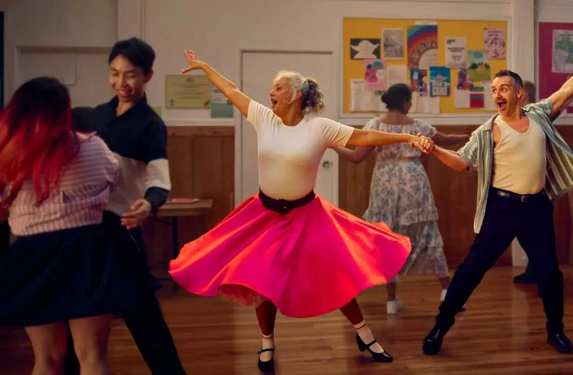 Woman in red dress dancing
