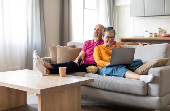 mature couple looking at laptop