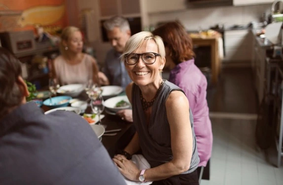 woman in glasses smiling