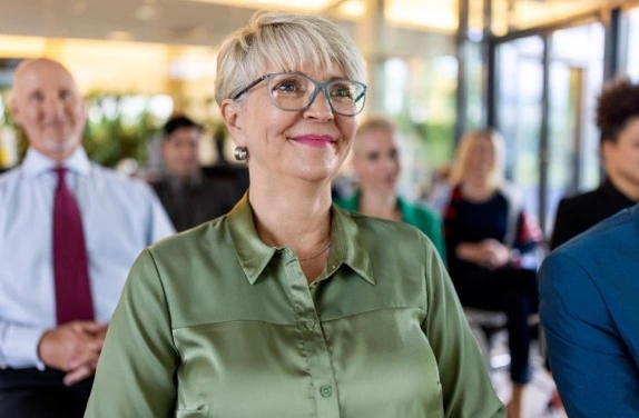 mature woman in green shirt