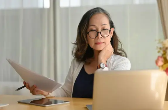 woman looking at papers